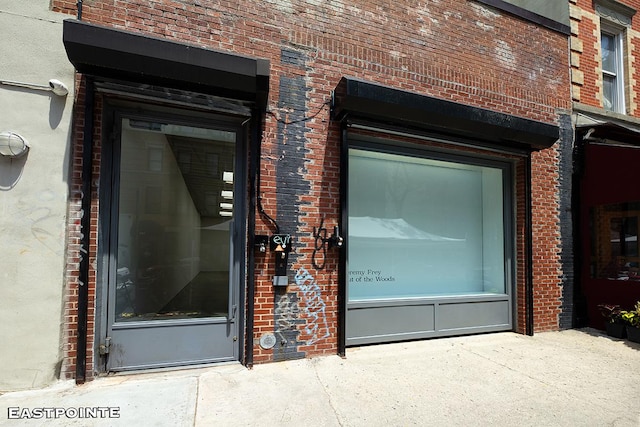 184 E 2nd St Unit 4G, New York City, NY 10009 - doorway to property featuring brick siding
