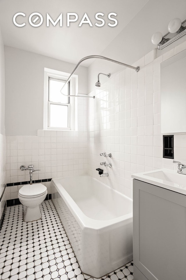 76-12 35th Ave Unit 6J, New York City, NY 11372 - full bathroom featuring shower / bath combination, vanity, and tile walls