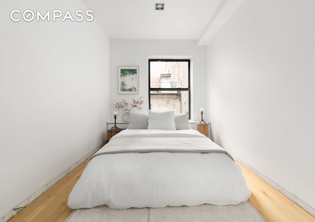 74 Warren St Unit 5W, New York City, NY 10007 - bedroom with wood finished floors