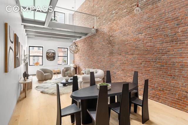 74 Warren St Unit 5W, New York City, NY 10007 - dining area featuring a high ceiling and wood finished floors