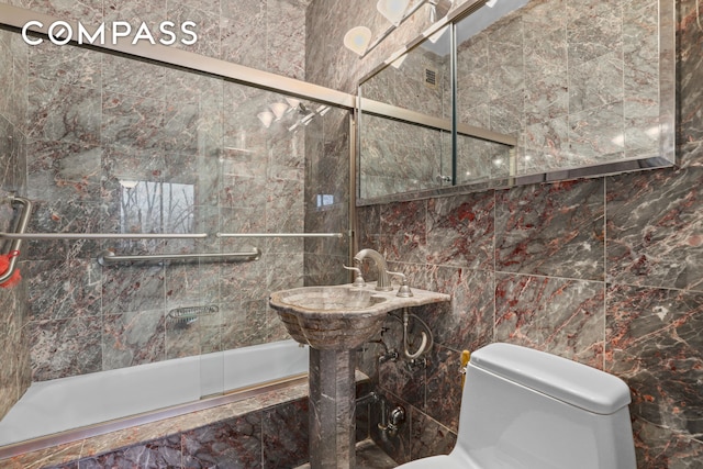 4455 Douglas Ave Unit 3Fe, New York City, NY 10471 - bathroom featuring tiled shower / bath and tile walls