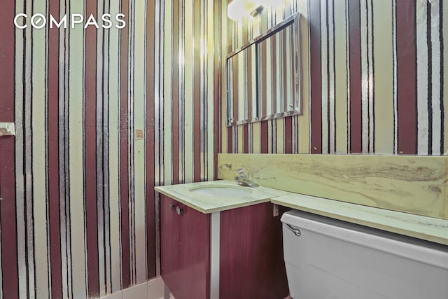 4455 Douglas Ave Unit 3Fe, New York City, NY 10471 - half bathroom featuring wallpapered walls and vanity