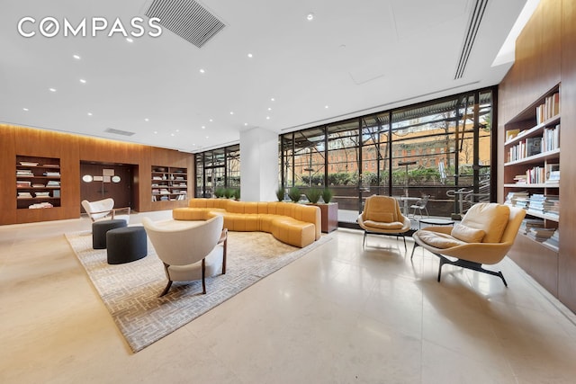 515 E 72nd St Unit 36B, New York City, NY 10021 - lobby with wooden walls, a wall of windows, and recessed lighting