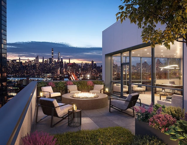 24-16 Queens Plz S Unit 3G, New York City, NY 11101 - patio terrace at dusk featuring a fire pit and a city view