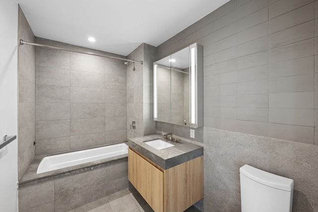 24-16 Queens Plz S Unit 3G, New York City, NY 11101 - full bathroom featuring vanity, tile walls, tiled shower / bath, tile patterned flooring, and recessed lighting