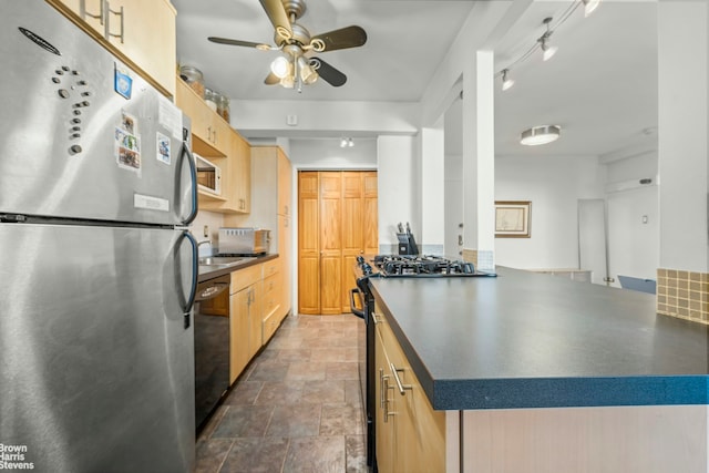 5425 Valles Ave Unit 5G, New York City, NY 10471 - kitchen featuring stainless steel appliances, light brown cabinetry, dark countertops, and a ceiling fan