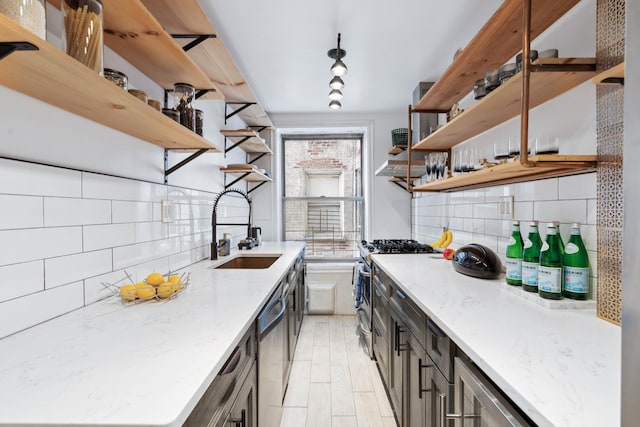 1075 Grand Concourse Unit 1G, New York City, NY 10452 - kitchen with open shelves, appliances with stainless steel finishes, tasteful backsplash, and light stone counters