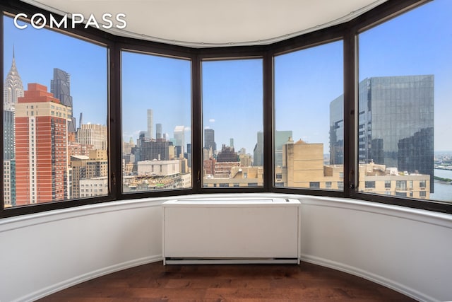 330 E 38th St Unit 41H, New York City, NY 10016 - unfurnished sunroom with a view of skyline and healthy amount of natural light