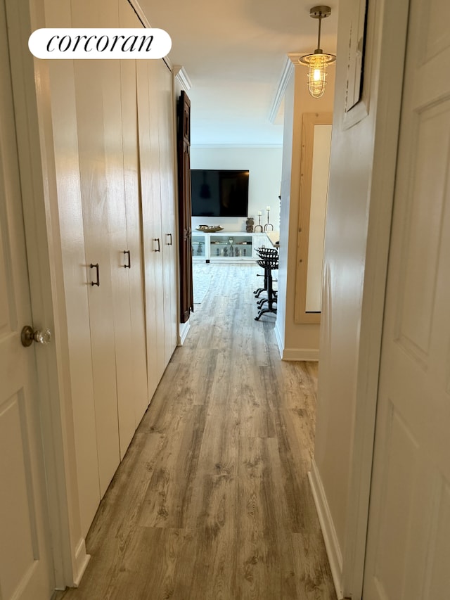 1641 3rd Ave Unit 8K, New York City, NY 10128 - corridor featuring light wood-type flooring and ornamental molding