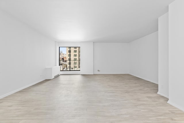 32 E 76th St Unit 605, New York City, NY 10021 - empty room featuring light wood-type flooring and baseboards