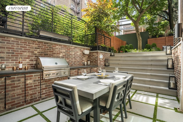 23 Bethune St Garden, Unit Garden, New York City, NY 10014 - view of patio / terrace featuring outdoor dining space and an outdoor kitchen