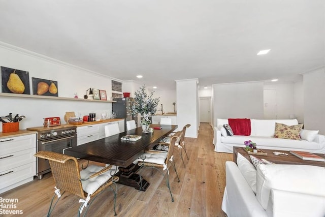 1001 5th Ave Unit 7A, New York City, NY 10028 - dining area featuring light wood-style flooring, recessed lighting, and ornamental molding