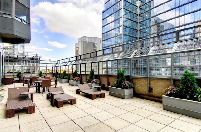 301 W 57th St Unit 16C, New York City, NY 10019 - view of patio featuring a view of city and outdoor dining area