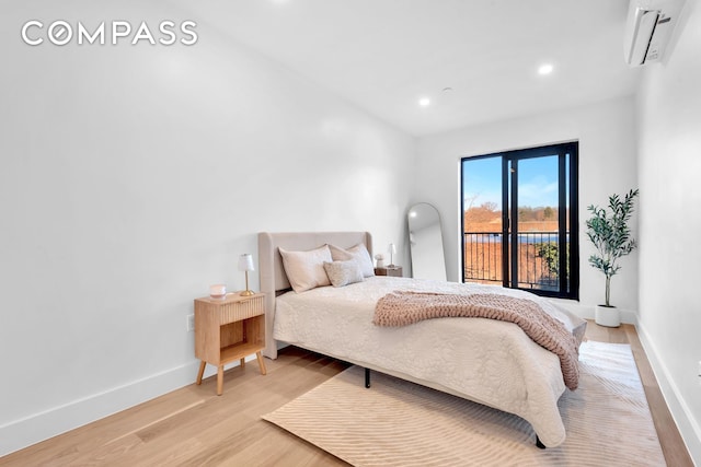 140 Moffat St Unit 3Ab, New York City, NY 11207 - bedroom featuring a wall mounted air conditioner, light wood-style flooring, and recessed lighting