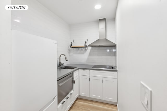 56 Pine St Unit 4C, New York City, NY 10005 - kitchen with wall chimney range hood, black electric stovetop, freestanding refrigerator, decorative backsplash, and open shelves