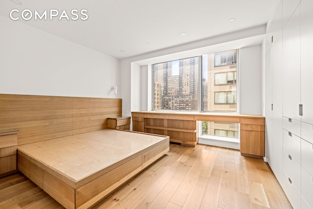 120 Riverside Blvd Unit 10W, New York City, NY 10069 - bedroom with light wood-style flooring and built in study area