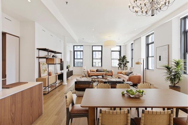 65 Leonard St Unit 3, New York City, NY 10013 - dining room featuring plenty of natural light, light wood-style flooring, a chandelier, and recessed lighting
