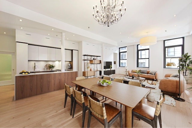 65 Leonard St Unit 3, New York City, NY 10013 - dining space featuring light wood-style flooring, recessed lighting, and a chandelier