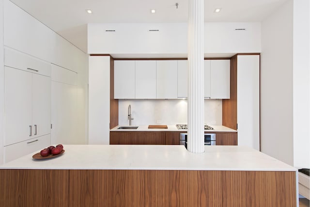 65 Leonard St Unit 3, New York City, NY 10013 - kitchen with modern cabinets, stainless steel appliances, white cabinetry, light countertops, and recessed lighting