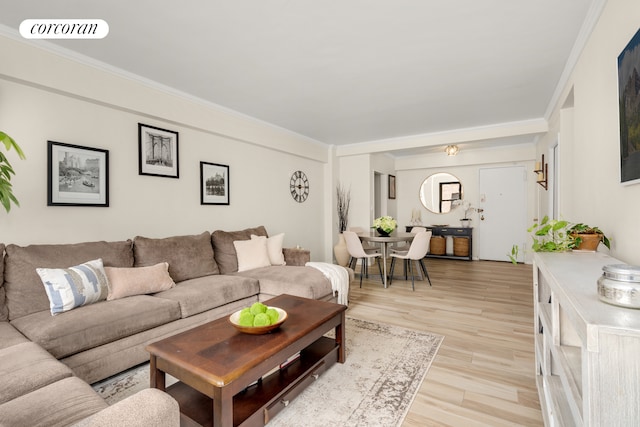 136 E 76th St Unit 10C, New York City, NY 10021 - living room featuring light wood-style floors and ornamental molding