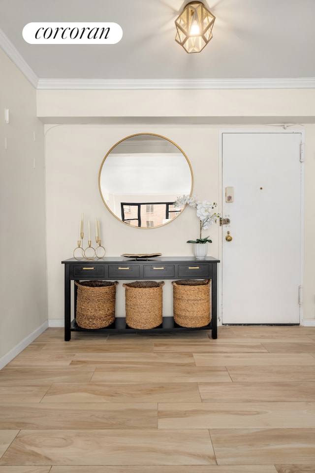 136 E 76th St Unit 10C, New York City, NY 10021 - foyer entrance with ornamental molding and light wood-style floors