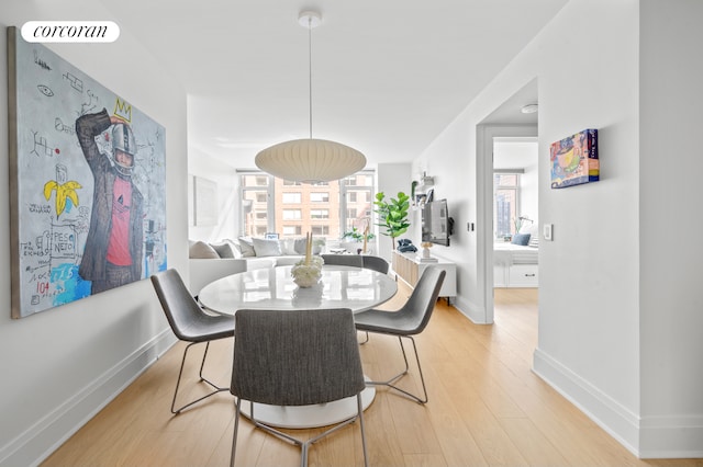 210 Warren St Unit 7F, New York City, NY 10282 - dining space with baseboards and light wood-style floors