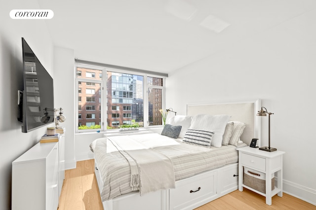 210 Warren St Unit 7F, New York City, NY 10282 - bedroom featuring light wood-type flooring