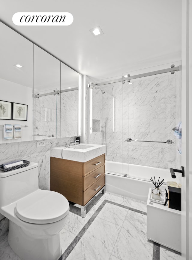 210 Warren St Unit 7F, New York City, NY 10282 - full bath featuring vanity, enclosed tub / shower combo, and marble finish flooring