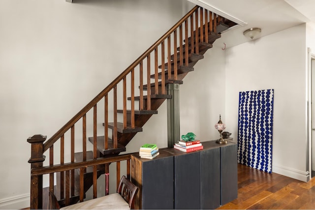 127 Cooper St, New York City, NY 11207 - stairway featuring wood finished floors and baseboards