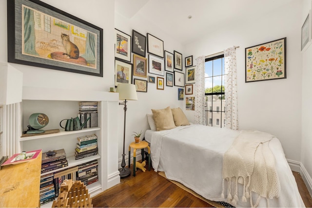 127 Cooper St, New York City, NY 11207 - bedroom featuring dark wood-type flooring