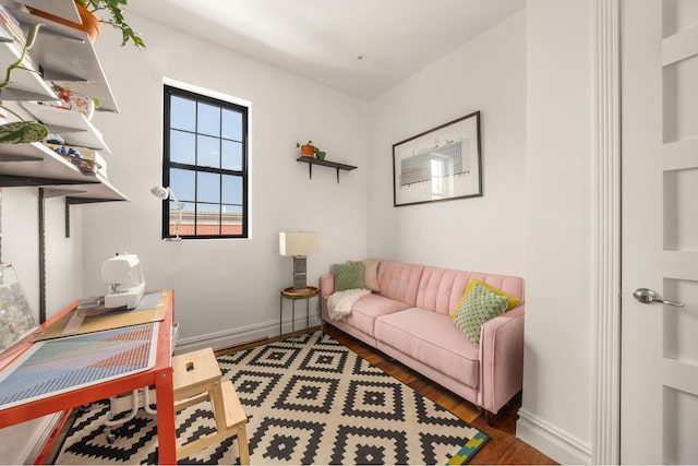127 Cooper St, New York City, NY 11207 - office space with baseboards and wood finished floors