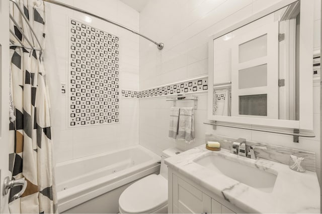 127 Cooper St, New York City, NY 11207 - full bathroom with a combined bath / shower with jetted tub, vanity, and tile walls