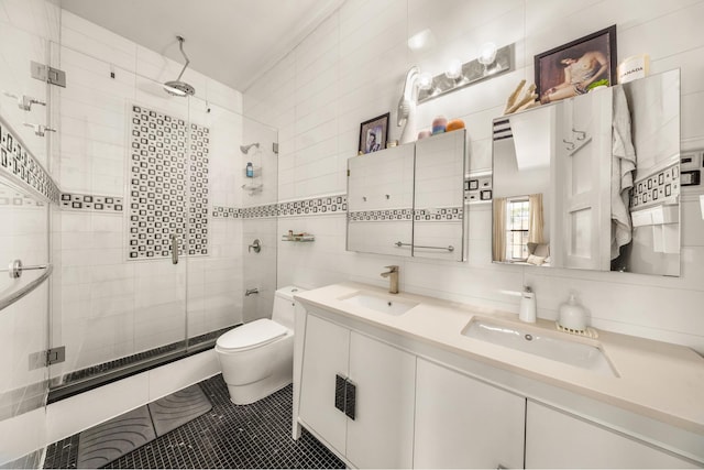 127 Cooper St, New York City, NY 11207 - full bathroom featuring double vanity, a shower stall, and tile walls