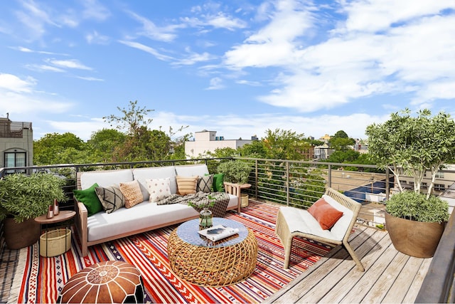 127 Cooper St, New York City, NY 11207 - wooden deck with an outdoor living space