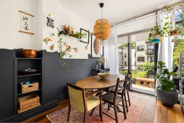 127 Cooper St, New York City, NY 11207 - dining room with wood finished floors