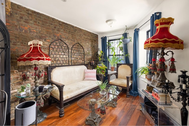 127 Cooper St, New York City, NY 11207 - sitting room with brick wall and wood finished floors