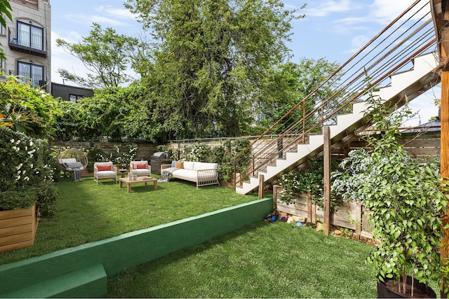 127 Cooper St, New York City, NY 11207 - fenced backyard with stairs and an outdoor living space