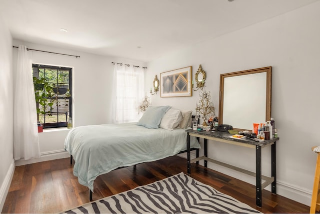 127 Cooper St, New York City, NY 11207 - bedroom with wood finished floors and baseboards