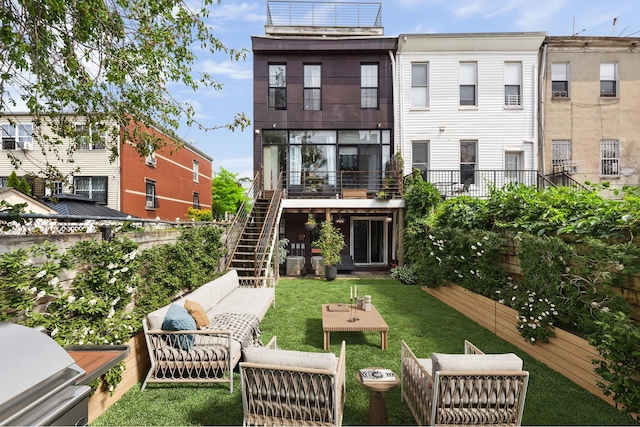 127 Cooper St, New York City, NY 11207 - back of house with outdoor lounge area and stairway