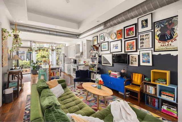 127 Cooper St, New York City, NY 11207 - living room featuring wood finished floors and recessed lighting