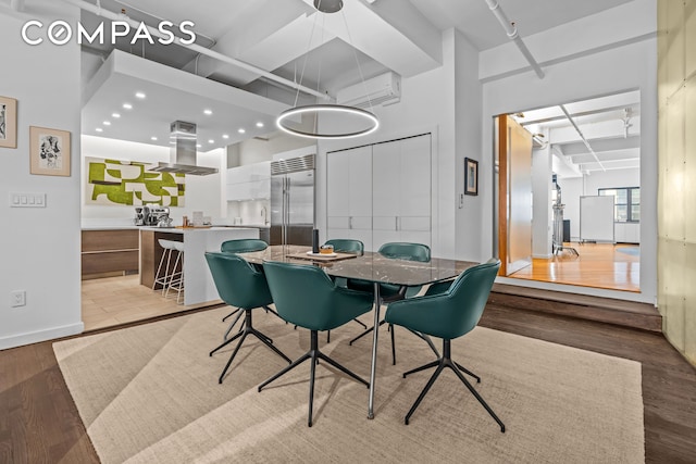 335 W 38th St Unit 6, New York City, NY 10018 - dining room featuring light wood-type flooring and recessed lighting