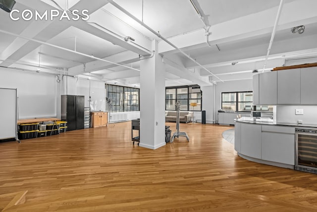 335 W 38th St Unit 6, New York City, NY 10018 - kitchen with wine cooler, freestanding refrigerator, and light wood finished floors