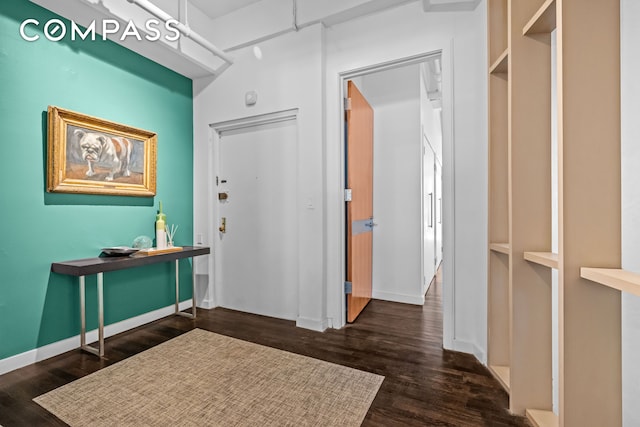 335 W 38th St Unit 6, New York City, NY 10018 - foyer featuring dark wood-type flooring