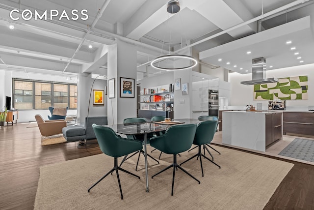 335 W 38th St Unit 6, New York City, NY 10018 - dining room with light wood-type flooring and recessed lighting