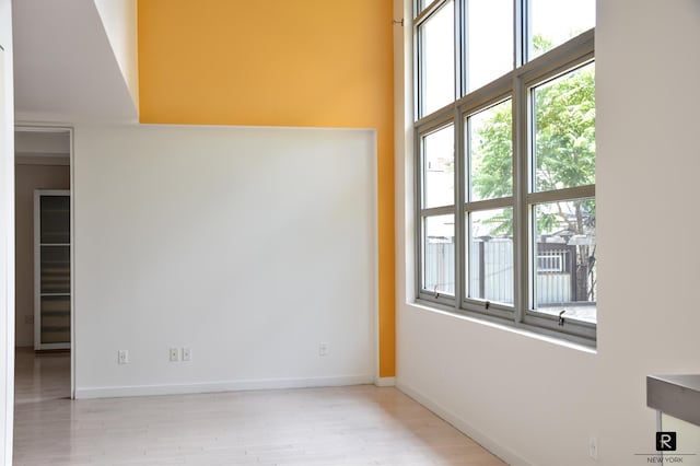 100 N 3rd St Unit 2B/4P, New York City, NY 11249 - empty room with healthy amount of natural light, wood finished floors, and a high ceiling