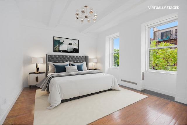 164 W 79th St Unit 4Ab, New York City, NY 10024 - bedroom featuring a chandelier, wood-type flooring, and beamed ceiling