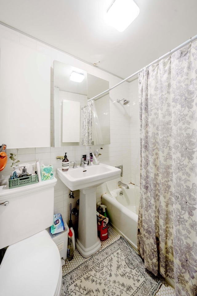 223 E 78th St Unit 2B, New York City, NY 10075 - bathroom with shower / tub combo with curtain and tile walls