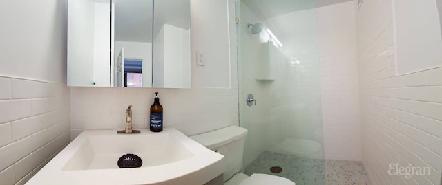 225 E 36th St Unit 1-A, New York City, NY 10016 - full bath featuring tile walls, a walk in shower, and vanity