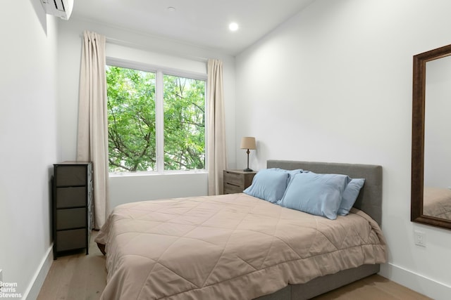 258 Winthrop St Unit 4A, New York City, NY 11225 - bedroom with wood finished floors, an AC wall unit, and recessed lighting