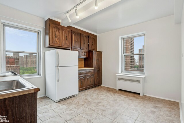 500 Grand St Unit C12A, New York City, NY 10002 - kitchen featuring freestanding refrigerator, radiator, plenty of natural light, and a view of city